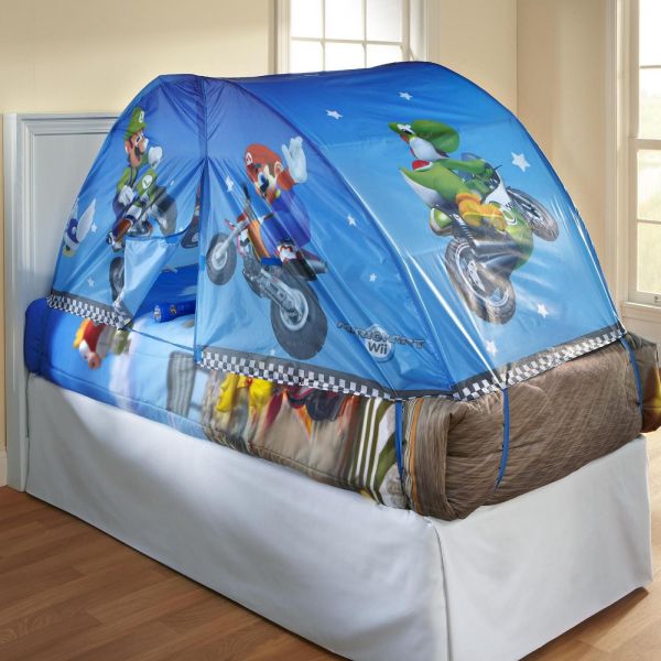 A bed with a Nintendo Mario Kart tent on it, enhancing the nursery room with toys.