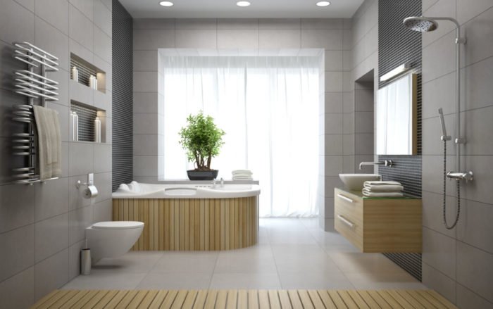 A modern spa bathroom with a bathtub, sink, and toilet.