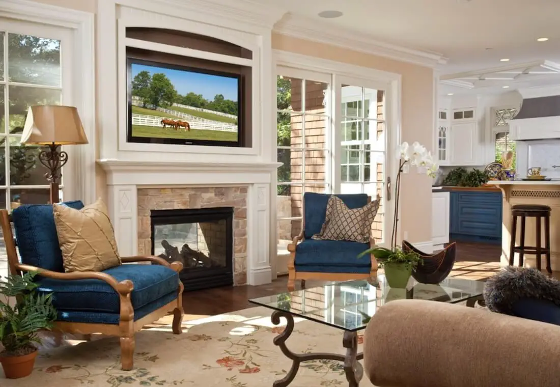 Elegant living room with fireplace and mounted television.