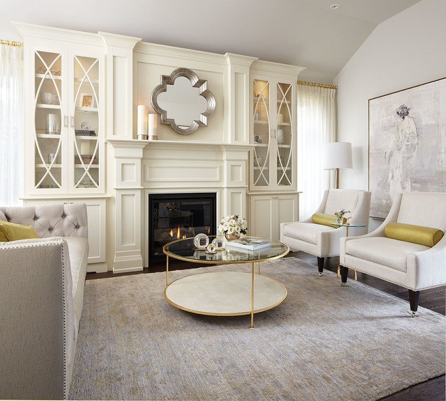 A sanctuary with white furniture and a fireplace.