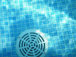 A safe swimming pool with a drain in the middle.