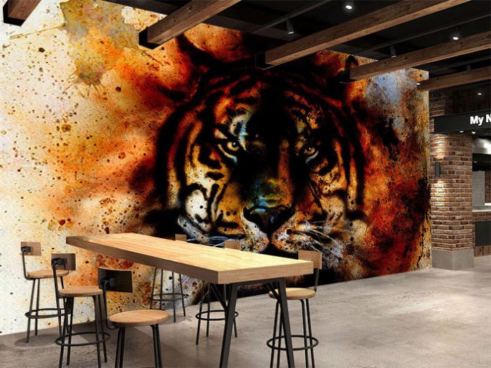 An image of a tiger on a dull wall in a restaurant.