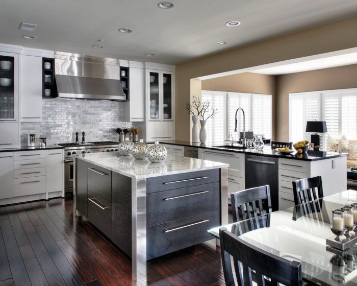 A contemporary kitchen with stainless steel appliances.