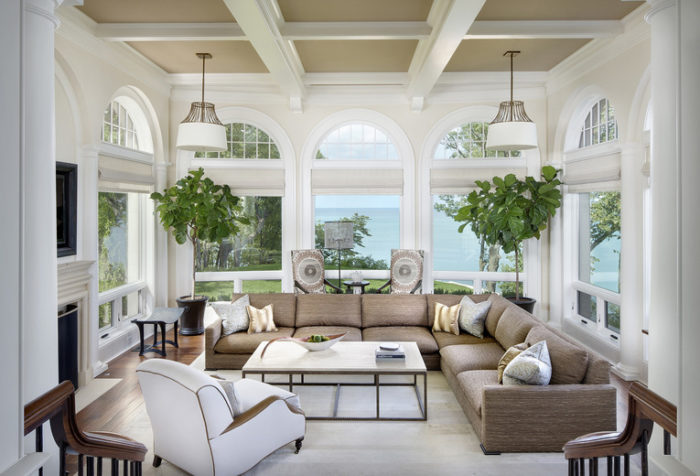 A large living room with large windows, perfect for interior designing.