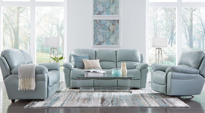 A living room with blue leather furniture.