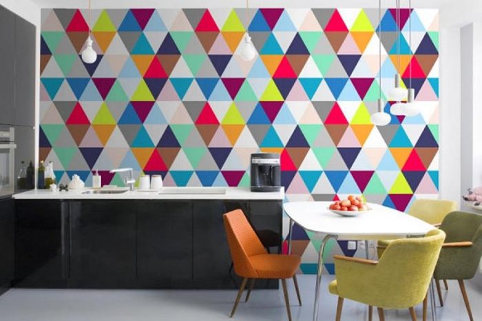 A kitchen with dull triangles on the wall.