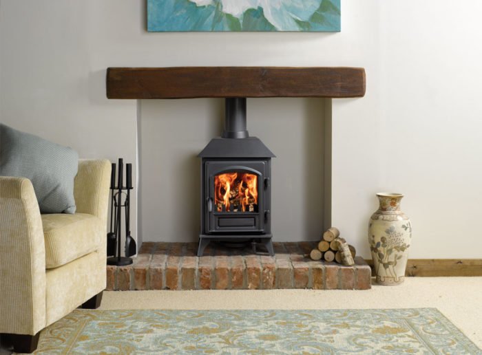 A wood burning stove in a living room.
