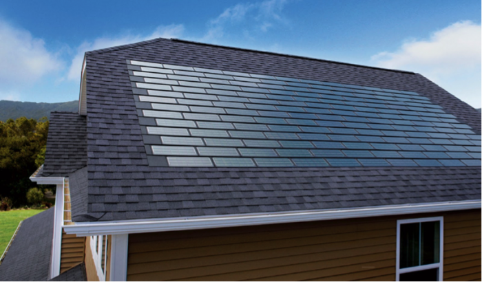 An unconventional solar panel on the roof of a house.