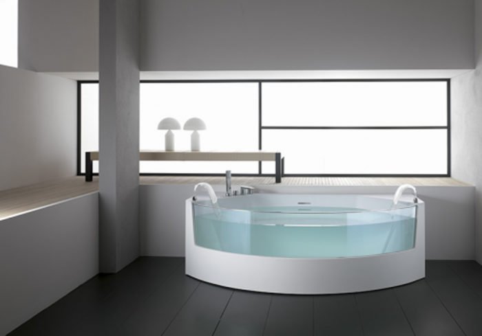 A stylish bathroom with a bathtub in the middle of the room.