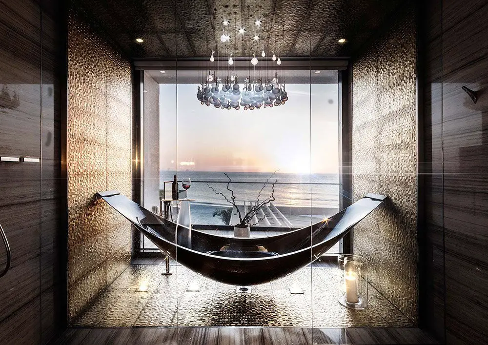 Luxury bathroom with ocean view and modern hammock tub.