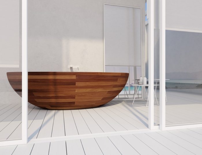 A stylish wooden bathtub positioned on a wooden deck.