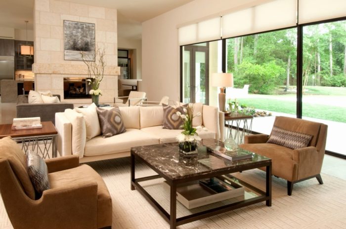 A cozy living room with a fireplace and sliding glass doors.