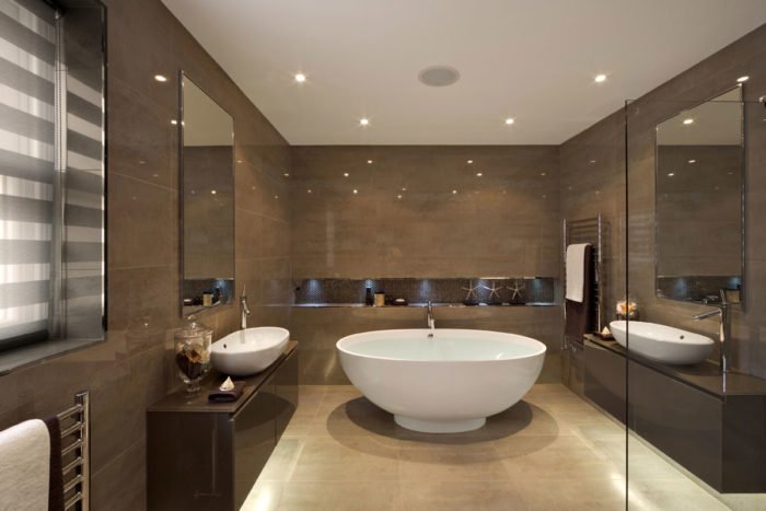 A stylish bathroom with a large tub.