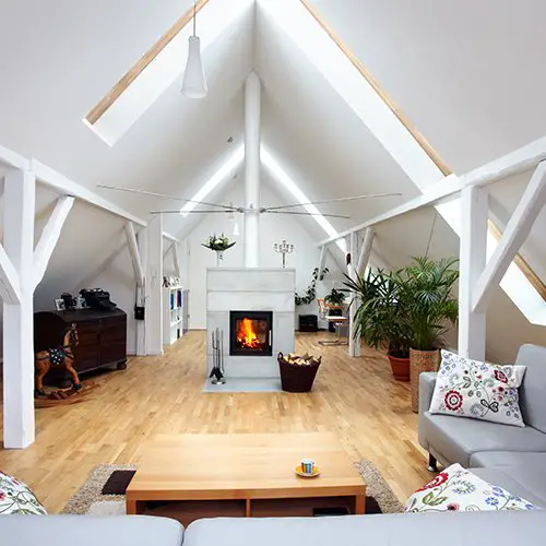 A living room with creative alternatives to traditional fireplaces and wooden beams.