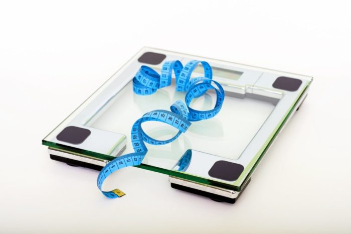 A glass scale for tracking weight loss progress.