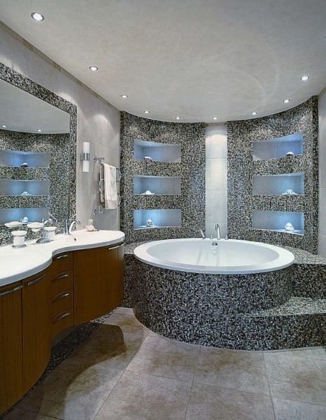 A stylish bathroom with a large tub and sink.