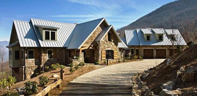 A mountain home with a metal roof.