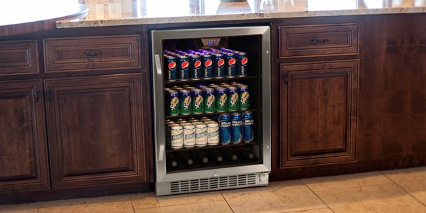 A new beverage cooler in a kitchen.