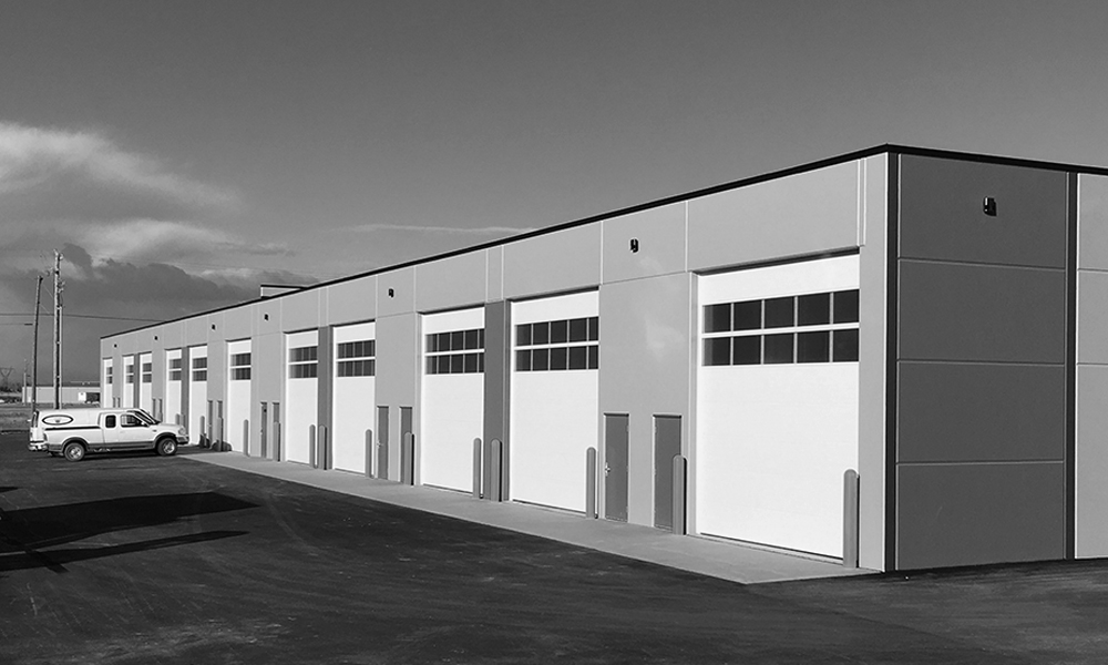 A black and white photo of a storage warehouse.