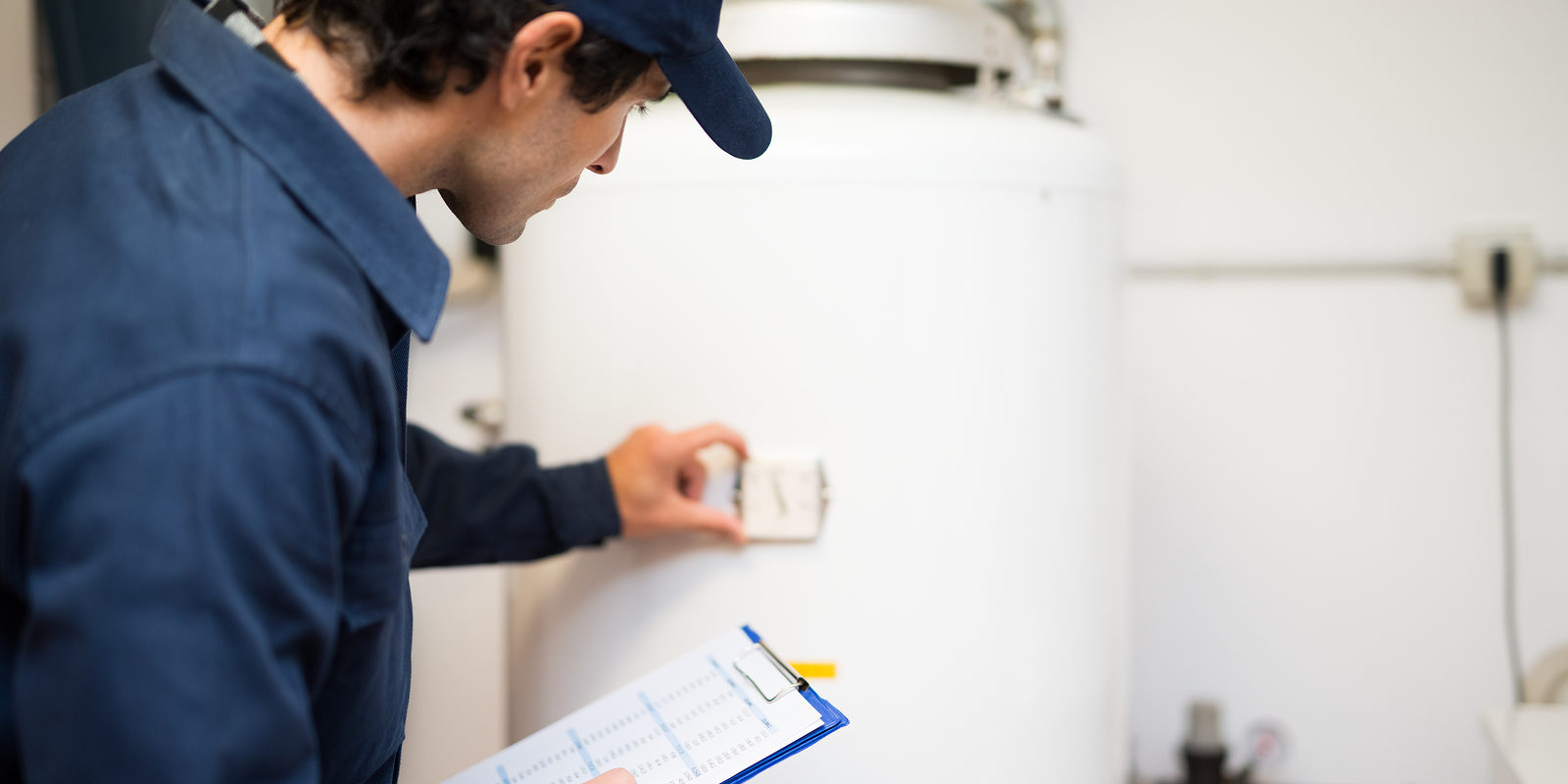 A plumber providing DIY tips for water heater maintenance.