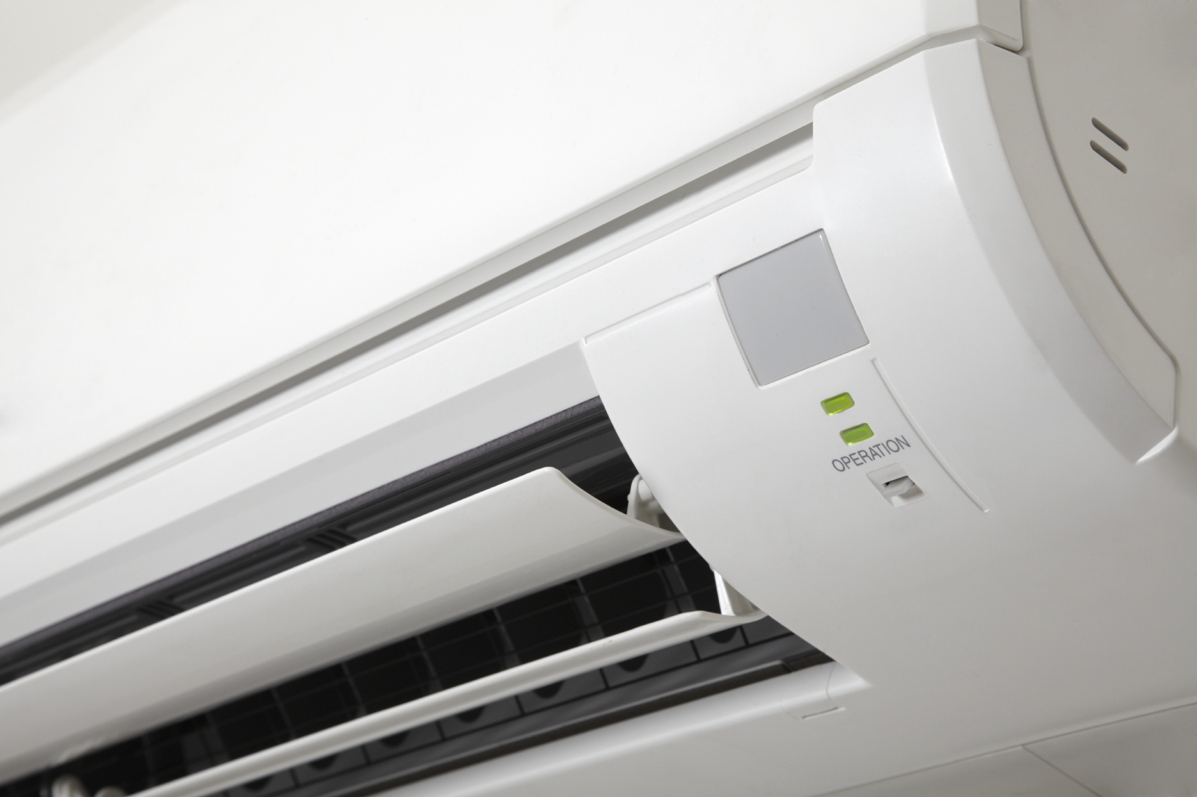A close up image of a white air conditioner used for service.