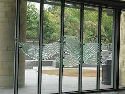 A bifold glass door with a design on it.