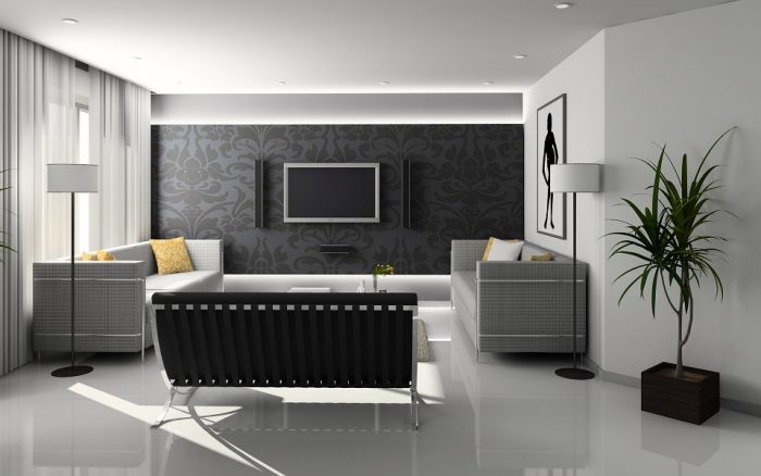 A black and white living room with wallpaper.