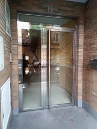 A brick building with a glass bifold door.