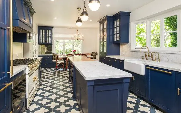 A kitchen with blue cabinetry.