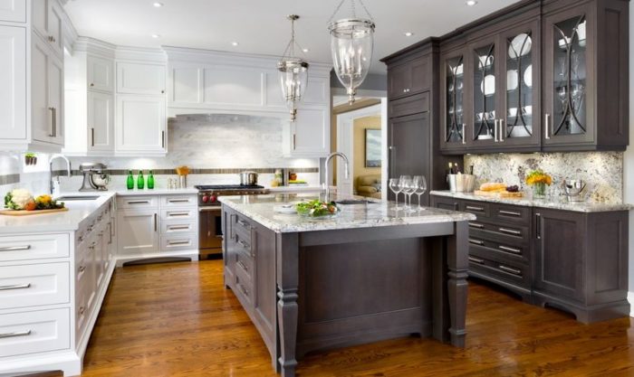 A trendy kitchen with white cabinets and a stylish center island.