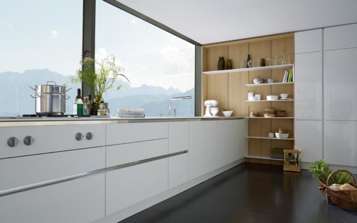 A white kitchen with a view of mountains, incorporating top kitchen trends of 2019.