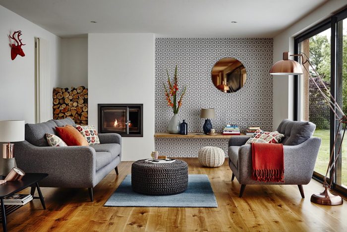 Spruce up a living room with grey furniture and a fireplace.