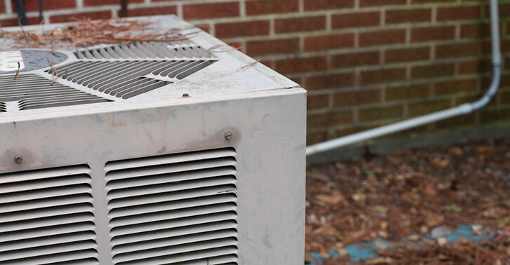Keywords: prevent, damaging

Description: Ways to prevent damaging an air conditioner sitting outside in front of a brick wall.