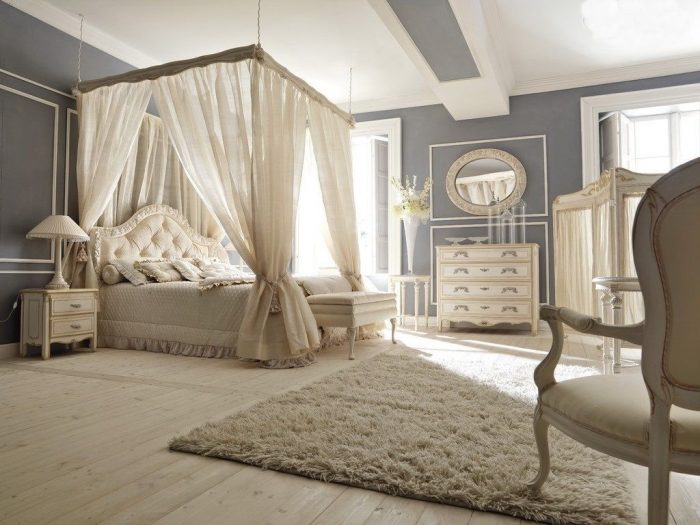 A cozy bedroom with a canopy bed.
