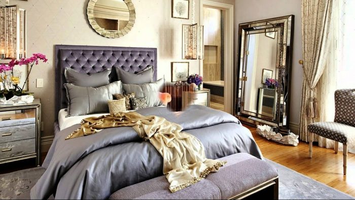 A bedroom with a large bed and a mirror, perfect for making memories together.