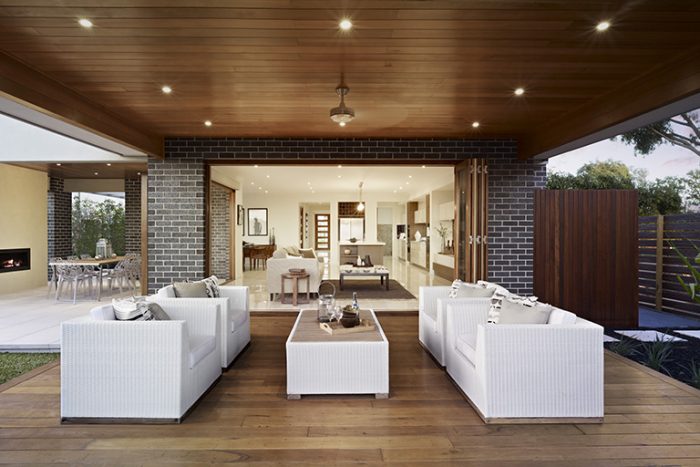An outdoor living area with white furniture.