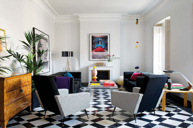 A living room showcasing the trendy black and white checkered floor for Summer 2019 home decor.