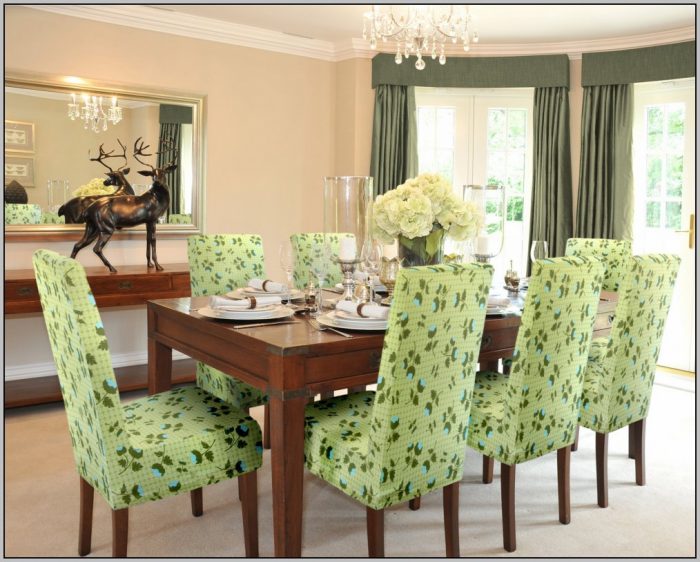 A dining room featuring green upholstered chairs - Home Decor Trends for Summer 2019.