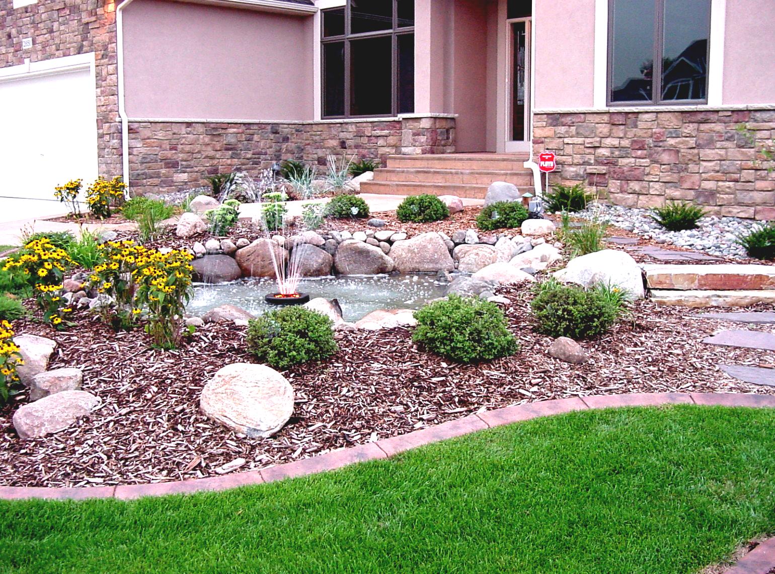A house with a rock garden designed using tools for gardening.