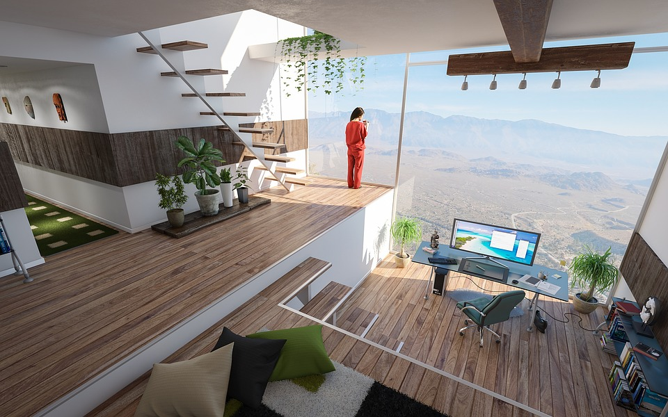 A tech-savvy living room with a view of the mountains.