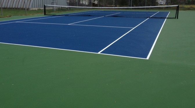 Build a blue and white tennis court with a net.