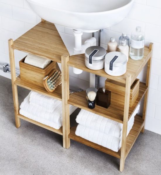 A bathroom with a wooden sink and seven storage ideas for small homes.