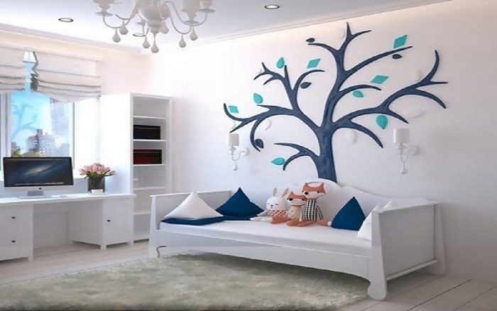 A Children's bedroom with a tree on the wall.