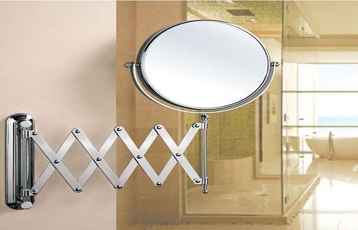 A mirror hanging in a bathroom.