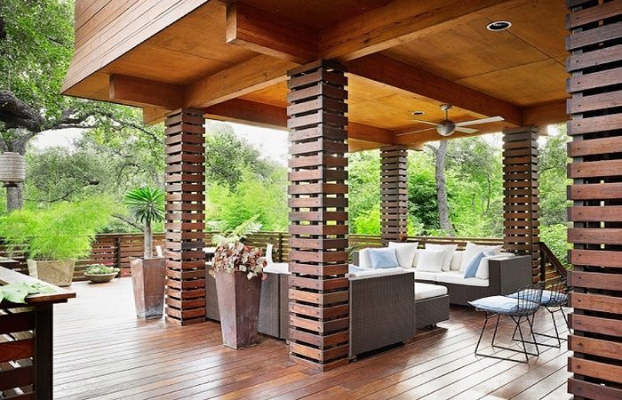 A wooden deck with landed furniture.