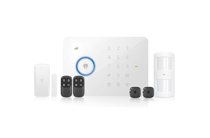 A wireless security system with remotes and a keypad.