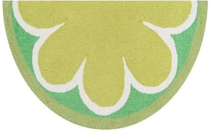 A green and white rug with a flower design perfect for the kitchen.