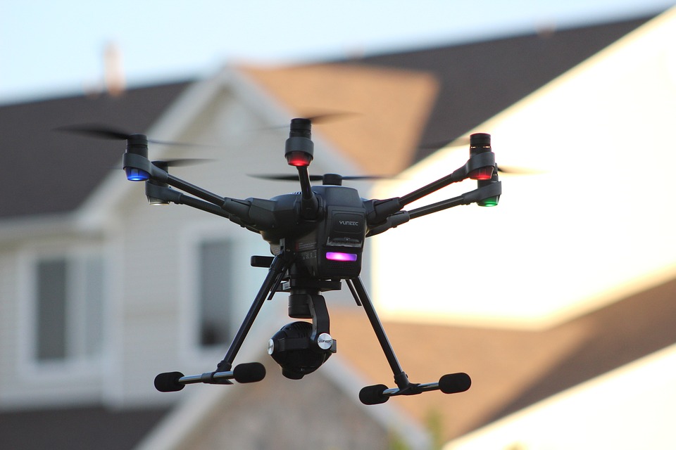 A photo drone in front of a house.