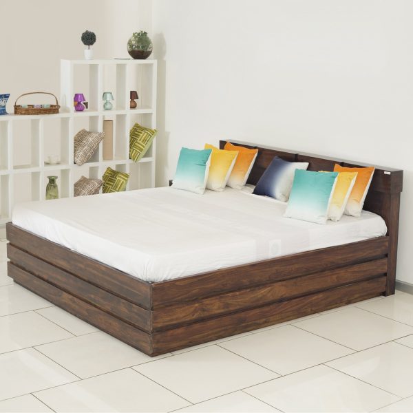 A wooden bed with pillows and a perfect mattress.