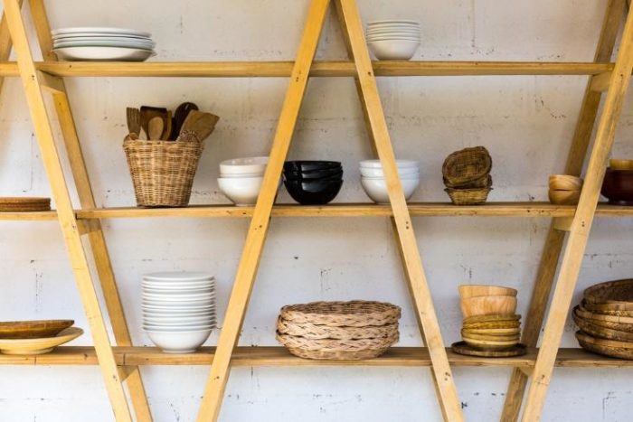 A trendy wooden shelf showcasing a variety of dishes.